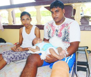 The injured Meena Molaha and Dhanraj Manoj with their three-month-old baby 