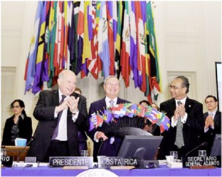 From left in this OAS photo at the meeting are Secretary General Jose Miguel Insulza, Jose Enrique Castillo, Foreign Minister of Costa Rica and Deputy Secretary General, Albert Ramdin.
