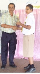 Region Three’s best NGSA performer Surendra Gocool receives his award from Regional Chairman Julius Faerber.  