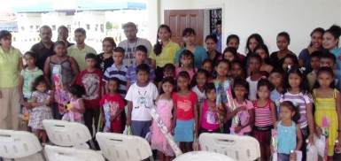  Staff of the BBCI pose with the children after handing over the kites and goodies to them yesterday 