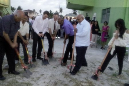 CEO of the Doobay Medical Centre, Dr Budhendranauth Doobay (first from left) with other members of the board and President Donald Ramotar (second from right) as they turned the sod yesterday for the expansion of the Doobay Medical Centre. 