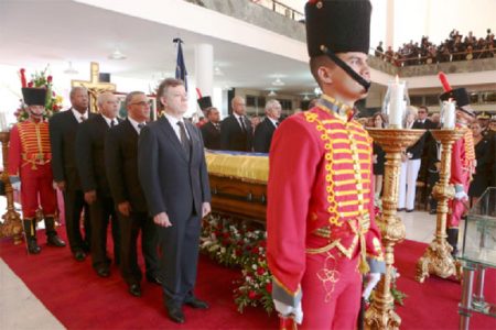 Visiting heads of state stand next to the coffin of Venezuela’s late President Hugo Chavez, during the funeral ceremony at the Military Academy in Caracas March 8, 2013. REUTERS/Miraflores Palace/Handout

