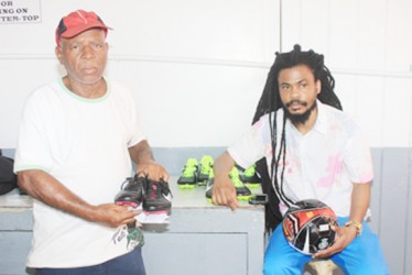 Camptown Football Classic host Gordon Van Rossum with tournament PRO Johnny ‘Overseas’ Barnwell displaying equipment to be given to players. 