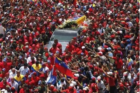 The coffin of Venezuela’s late President Hugo Chavez is driven through the streets of Caracas after leaving the military hospital where he died of cancer, in Caracas March 6, 2013.
REUTERS/Jorge Dan Lopez
