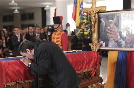 Iran's President Mahmoud Ahmadinejad pays tribute to late Venezuelan President Hugo Chavez, during the funeral service at the Military Academy in Caracas March 8, 2013, in this picture provided by the Miraflores Palace.
REUTERS/Miraflores Palace/Handout