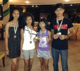 The medal winners at the just-concluded Suriname International badminton tournament. 