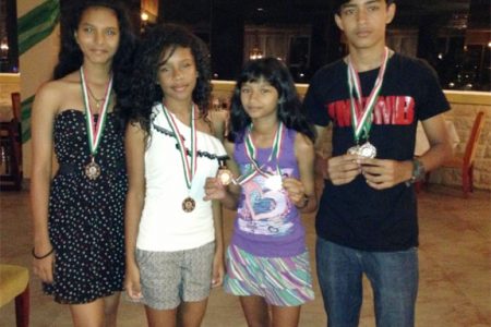 The medal winners at the just-concluded Suriname International badminton tournament.