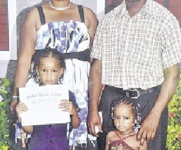 Thirty-two-year-old farmer Rodney Drummond of Content, Adelphi, St James; and 33-year-old hotel worker Tanisha Small of Hopewell, Hanover, with their two daughters Tia (right) and Ranisha Drummond, five and eight respectively. (Jamaica Observer photo)