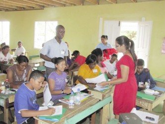 Tricia Watson, Coordinator, Ministry of Labour, Human Services & Social Security Counter- Trafficking Unit explaining to Region Nine residents about Trafficking in Persons (TIP) at a recent workshop in Shulinab (Government Information Agency photo)