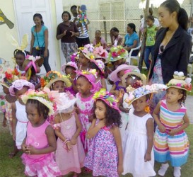 Little Kiskadee Kids misses model their Easter hats at an event  held at the Kitty location on Thursday  