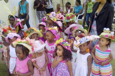 Little Kiskadee Kids misses model their Easter hats at an event
held at the Kitty location on Thursday  