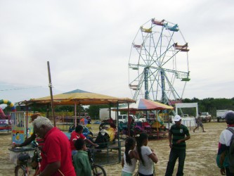 A ferris wheel in the background at the Lethem Rodeo