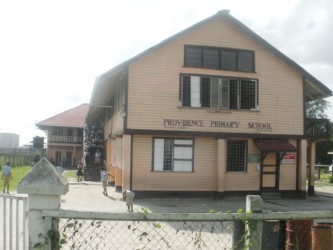 Students of the Providence Primary School amble down the stairs after the National Grade Six Assessment. 