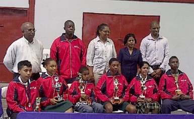 Members of the Guyana team flanked by members of the GTTA