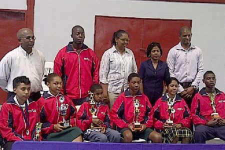 Members of the Guyana team flanked by members of the GTTA