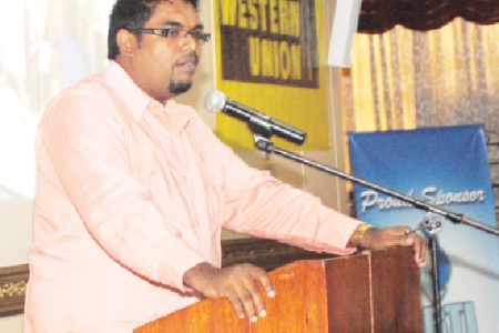 Acting Tourism Industry and Commerce Minister Irfan  Ali addressing a small business forum at the Pegasus Hotel on Wednesday