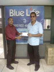 President of Roraima Bikers Club, Brian Allen (right) receives the sponsorship cheque from Caribbean International Distributors Inc. Area Supervisor, Ryan Chung. 