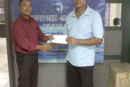 President of Roraima Bikers Club, Brian Allen (right) receives the sponsorship cheque from Caribbean International Distributors Inc. Area Supervisor, Ryan Chung.