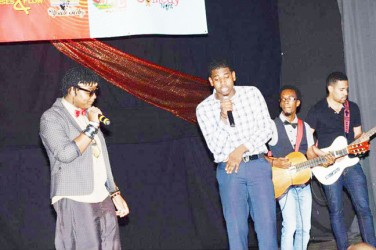 Collage’s A-TayJah, Christian Sobers and Lerone Souvenir performing at the Slam Poetry final