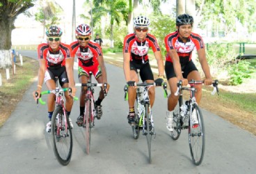 Team Coco’s riders Paul DeNobrega, Raynauth Jeffrey, Raul Leal and Christopher Holder pose for a Stabroek Sport photo before training yesterday. (Orlando Charles photo) 