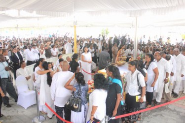 Mourners queuing up for a viewing of the body