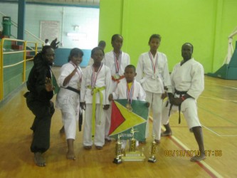 The karatekas with their medals following the championships in Trinidad and Tobago.    