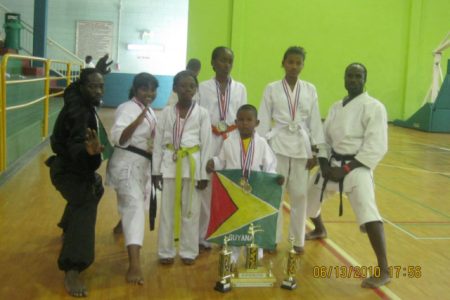 The karatekas with their medals following the championships in Trinidad and Tobago.
