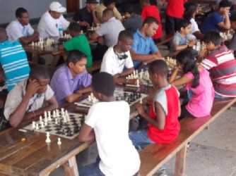 Last Sunday, Banks DIH Malta sponsored a $100,000 one-day rapid chess tournament at the Tain, Berbice, University of Guyana campus. A number of young chess players expressed an interest in competing against their senior counterparts. The tournament was won by Taffin Khan, but the juniors played well and carried off some of the trophies, medals and cash prizes. Pictured here are some of the junior participants
