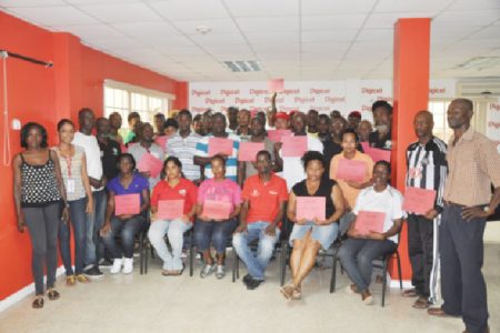 Participants with their certificates along with Digicel’s representatives last evening at the conclusion of the Digicel’s Kickstart workshop.