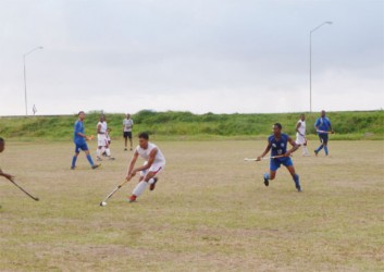 Action between the Old Fort and GCC hockey teams yesterday.