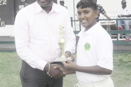 Man-of-the-Match Bhaskar Yadram receiving his trophy from GCB vice-president, Alfred Mentore.