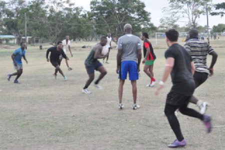 The national rugby squad working on defensive alignments during yesterday’s practice at the National Park Rugby Field. (Orlando Charles photo)

