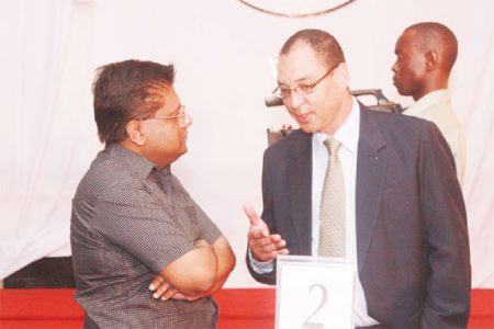 Don Wehby (right) in discussion with Finance Minister Ashni Singh