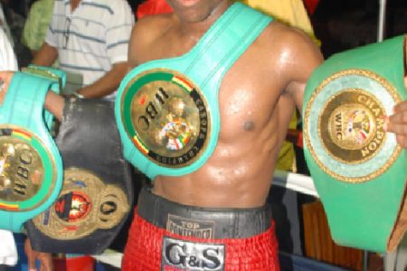 Next World Champion? Clive ‘The Punisher’ Atwell basking in glory after he defeated Venezuelan, Raphael ‘El Potro’ Hernandez for the vacant WBC CABOFE featherweight title on Saturday night. (Orlando Charles photo).