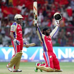 Chris Gayle sinks to his knees after bringing Pune Waarriors to their knees with his blitzkrieg knock of 175 not out in the Indian Premier League. (Cricinfo photo)
