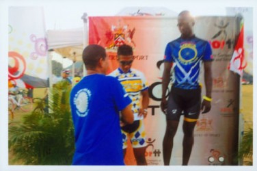 Neil Reece collecting his silver medal after competing at the Easter Grand Prix in Trinidad and Tobago 