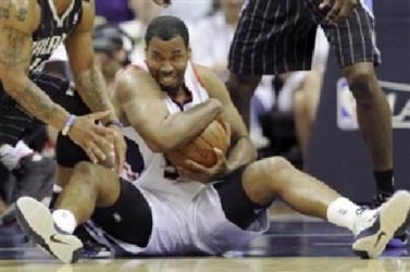 Atlanta Hawks center Jason Collins controls the ball during an NBA Eastern Conference Game 6 playoff against the Orlando Magic in Atlanta, Georgia in this file photo taken April 28, 2011. REUTERS/David Tulis