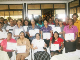  Some of the newly trained clerks pose with their certificates