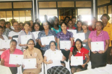  Some of the newly trained clerks pose with their certificates