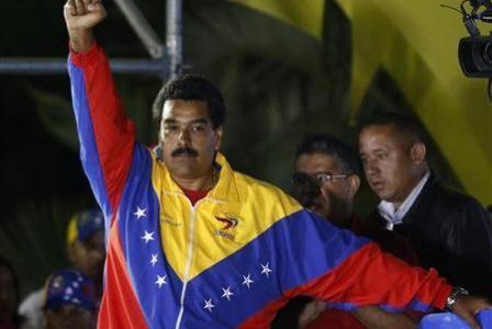 Venezuelan presidential candidate Nicolas Maduro celebrates after the official results gave him a victory in the balloting, in Caracas April 14, 2013.
REUTERS/Tomas Bravo