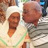 Centenarian Louise Pierre, left, receives a congratulatory kiss from her son Hercules during her 100th birthday celebrations in Blanchisseuse yesterday.(Trinidad Express photo) 