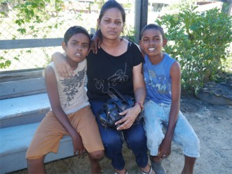 Jeanette Hookumchand and her two sons; Jonathan (at right) and Cliston 