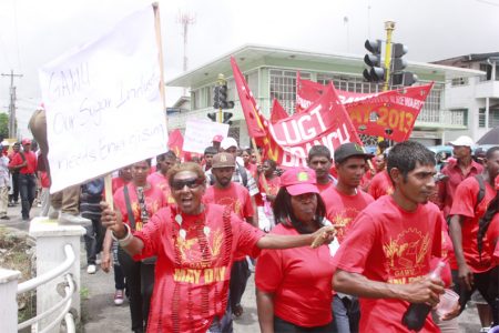 This particularly vibrant group of sugar workers, marching under the Guyana Agricultural and General Workers Union (GAWU) heading for the National Park where the FITUG Rally was held yesterday. (Photo by Arian Browne)