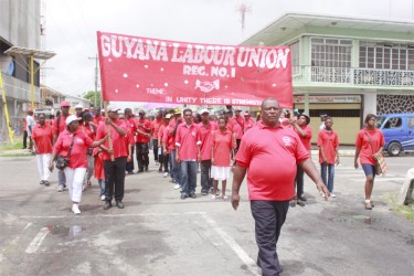 Workers marching under the Guyana Labour Union, Region One banner wend their way along Albert Street yesterday as the May Day parade drew to a close. (Photo by Arian Browne)