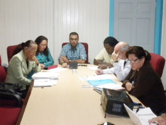 Minister of Natural Resources and the Environment Robert Persaud (centre) with Minister of Amerindian Affairs Pauline Sukhai (second from left), with other officials and representatives of RUSAL as they met with residents of Hururu yesterday. (Natural Resources Ministry photo) 
