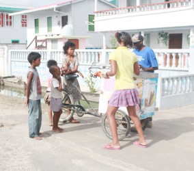 Mr Frostee! Children waiting to be served as they bought ice creams from the push cart vendor