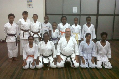 In the picture Amir Khouri, centre, kneeling and some of the karatekas.