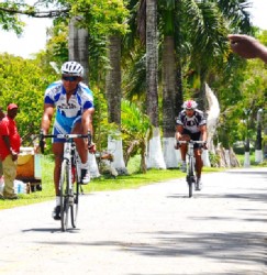 Paul Choo-Wee-Nam about to cross the finish line ahead of Stephen Fernandes in the feature 35-lap event of the Powerade 11-race cycling programme which was staged at the National Park yesterday.
