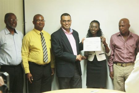 Minister of Natural Resources Robert Persaud (centre) at the signing. From left are William Woolford, GGMC Commissioner Rickford Vieira, an employee of the WWF and Dr Patrick Williams.