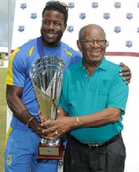 Barbados captain Kirk Edwards hugs Barbados and West Indies batting legend Sir Everton Weekes at the presentation of the Headley/Weekes Trophy. (WICB media) 